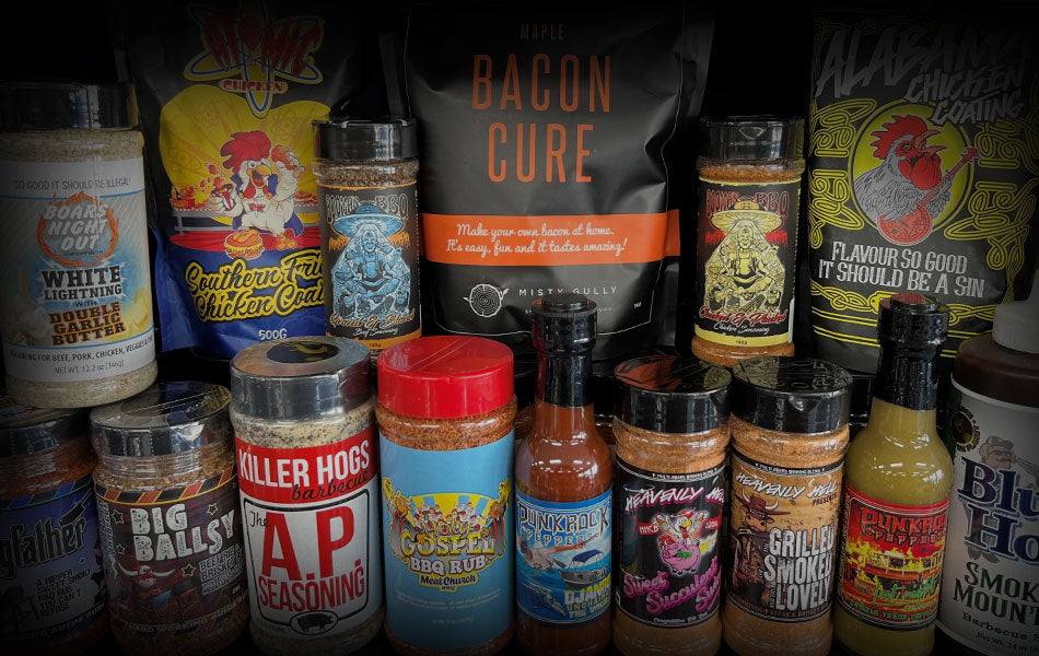 Selection of BBQ rubs and sauce bottles displayed at Smoked BBQ Co.