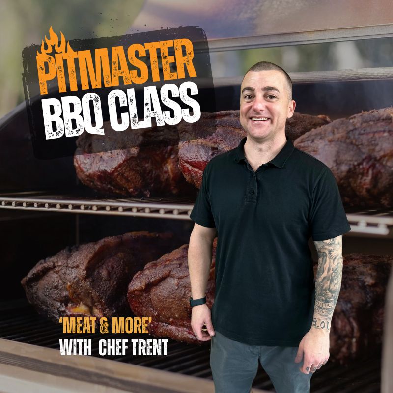 Man standing in front of a grill with 'Pitmaster BBQ Class' text and barbecue meats.