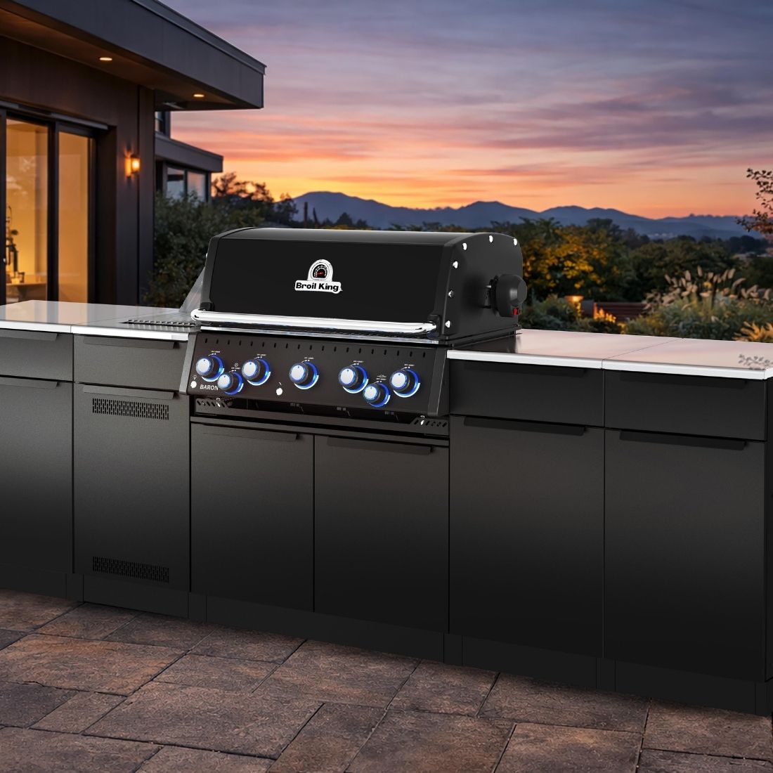 A Royal King modular outdoor kitchen on a deck overlooking the valley with a sunset