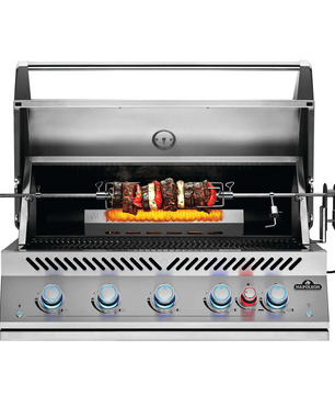 A stainless steel outdoor rotisserie grill with five blue and red control knobs on the front, shown open with a rotisserie spit holding grilled meat and peppers over a flame. The brand name 'Starfire' is visible on the lower right front panel.