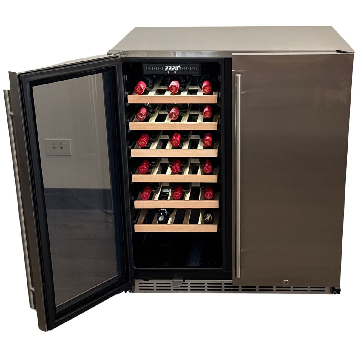 A stainless steel wine refrigerator with an open glass door, showing multiple shelves with wine bottles on wooden racks against a white background.