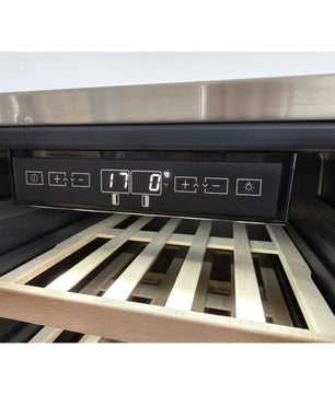 Close-up of a wine cooler control panel with a digital display and buttons, set inside a stainless steel wine refrigerator with wooden slatted shelves visible.