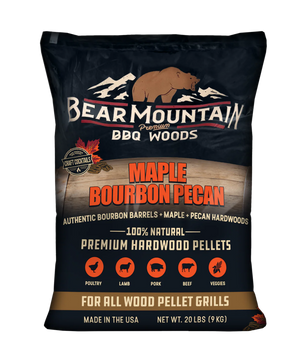 A 20 lb bag of Bear Mountain Premium BBQ Woods Maple Bourbon Pecan hardwood pellets, featuring a dark navy blue bag with a brown bear logo and product details.
