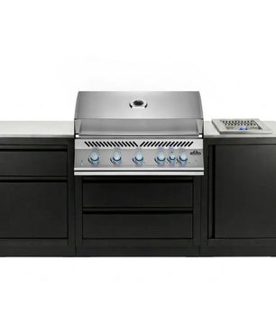 A professional outdoor kitchen island set featuring a stainless steel gas grill with six blue-tipped knobs, a matching stainless steel side burner, and black cabinets with a light gray stone countertop, shown against a plain white background.