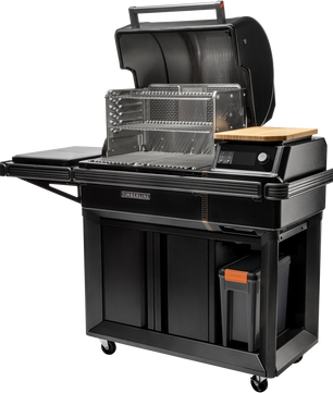 Black outdoor grill with various accessories on a white background