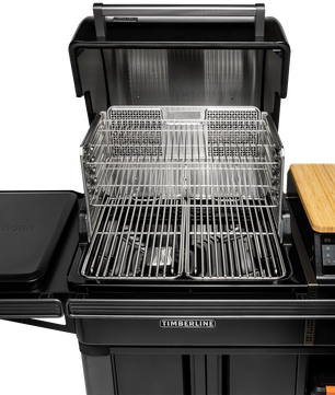 Portable grill with multiple cooking surfaces on a white background