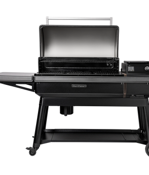 Black grill on wheels with open lid on a white background