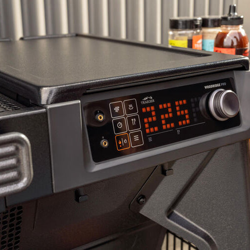 Portable grill with digital temperature display on a stand