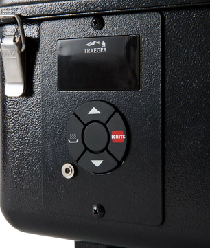 Control panel with Traeger logo on a black surface