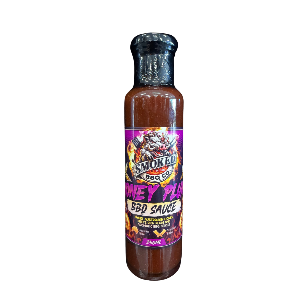A 250ml bottle of Smoked BBQ Co Honey Plum BBQ Sauce, featuring a black cap and a colorful label with a dragon graphic, set against a plain white background.