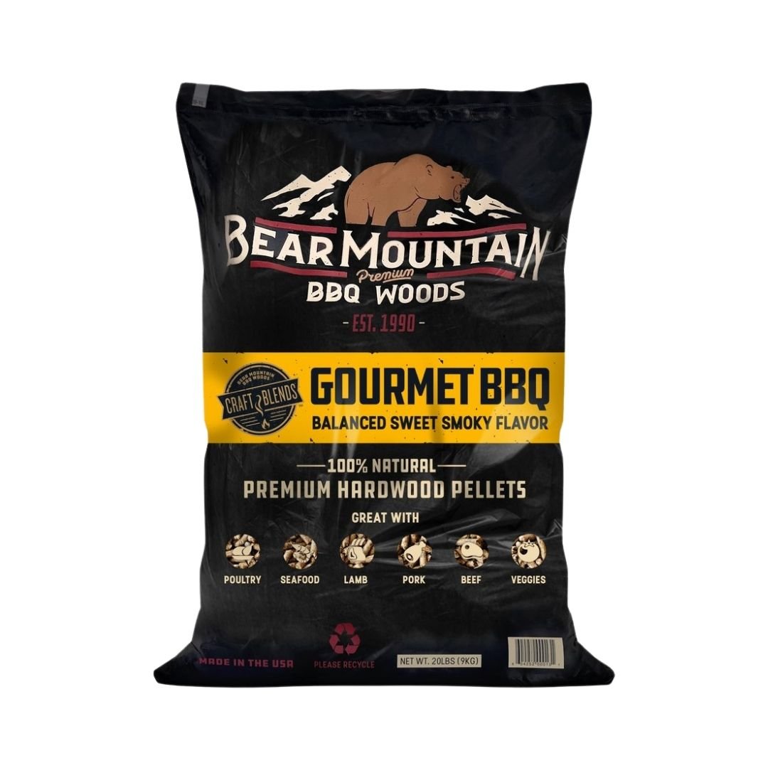 A black bag of Bear Mountain Gourmet BBQ hardwood pellets on a plain white background. The packaging features a brown bear logo, white and yellow text, and illustrations of different meats at the bottom.