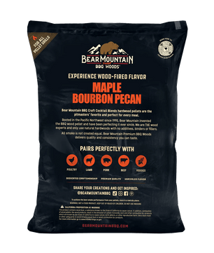 A large black bag of Bear Mountain BBQ Wood Co. Maple Bourbon Pecan hardwood pellets, showing the back of the packaging with product details, flavor text, pairing icons, and a circular seal.
