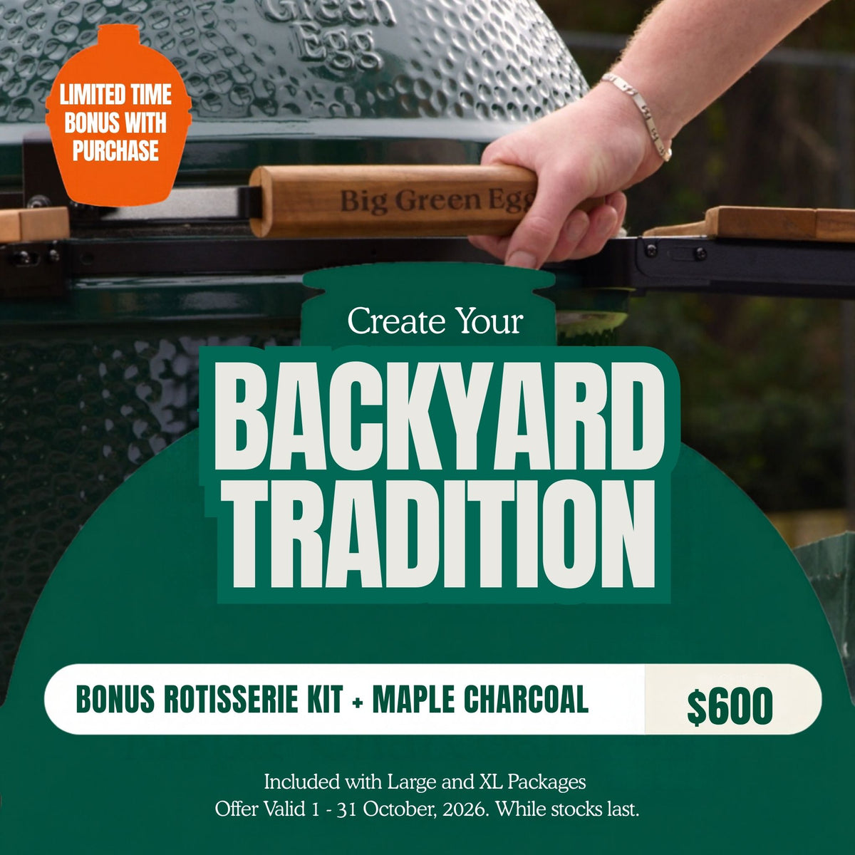 Promotional graphic for a Big Green Egg grill offering a bonus rotisserie kit with maple charcoal. A hand is shown holding the wooden egg lifter on a dark green ceramic grill.
