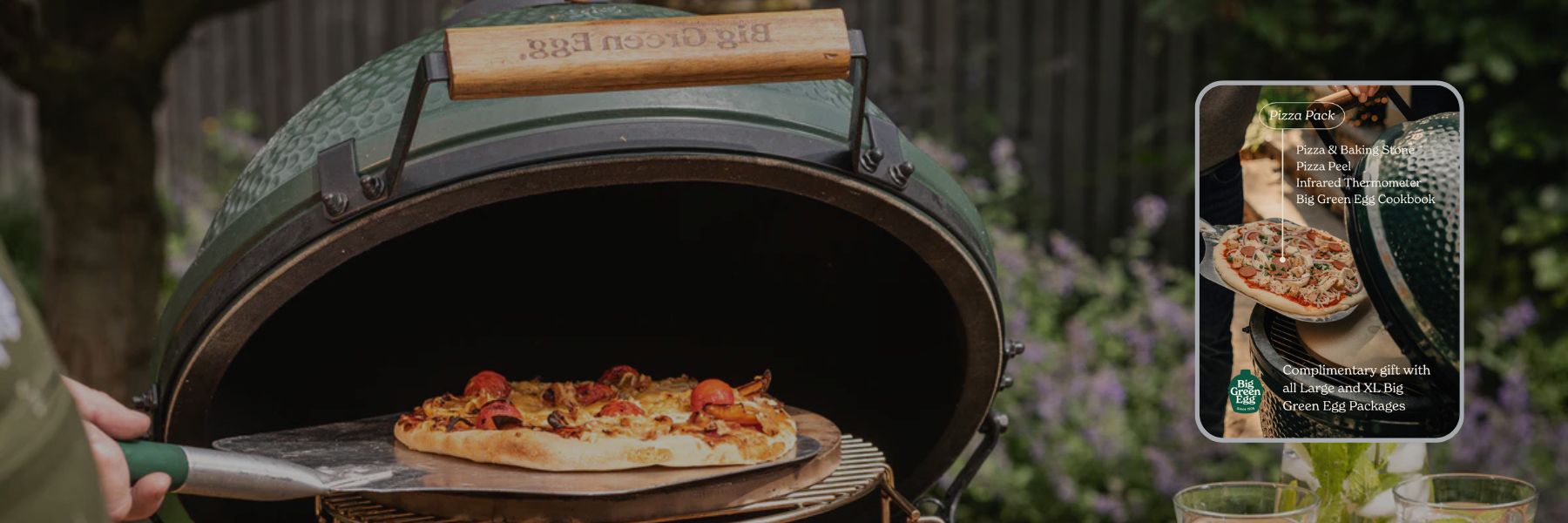 Pizza cooking in a Big Green Egg in the outdoors garden