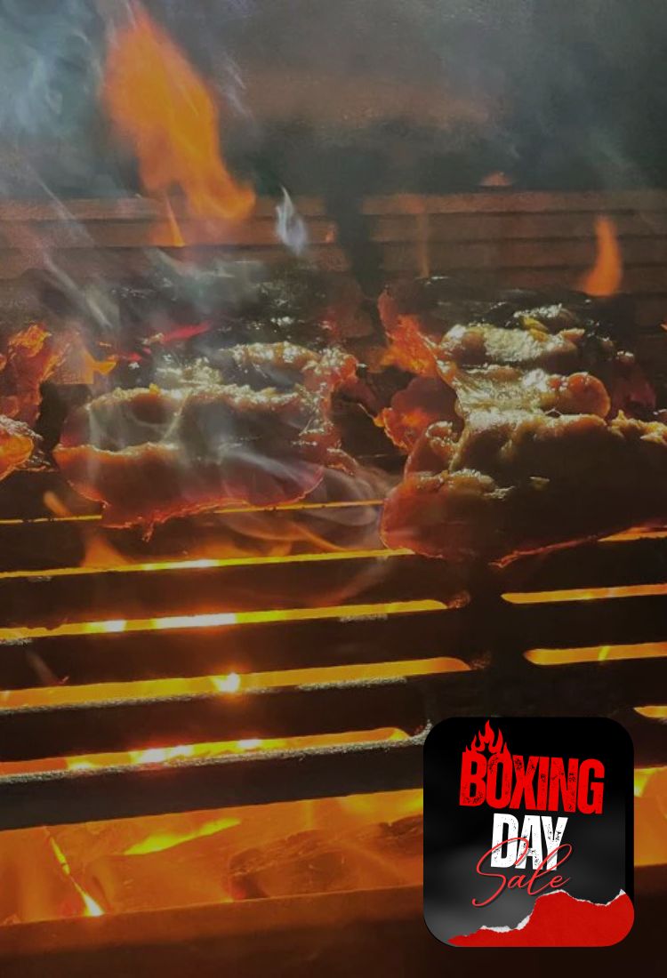 Grilled meat on a barbecue with 'Boxing Day Sale' text overlay