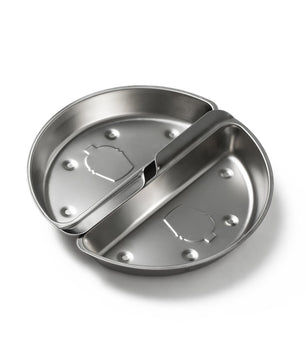 Stainless steel camping pan with lid on a white background
