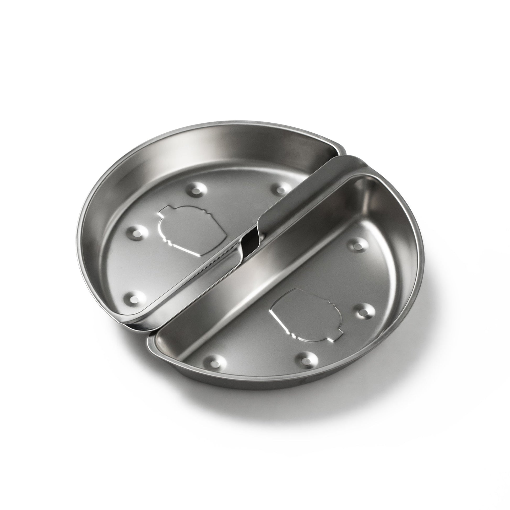 Stainless steel camping pan with lid on a white background