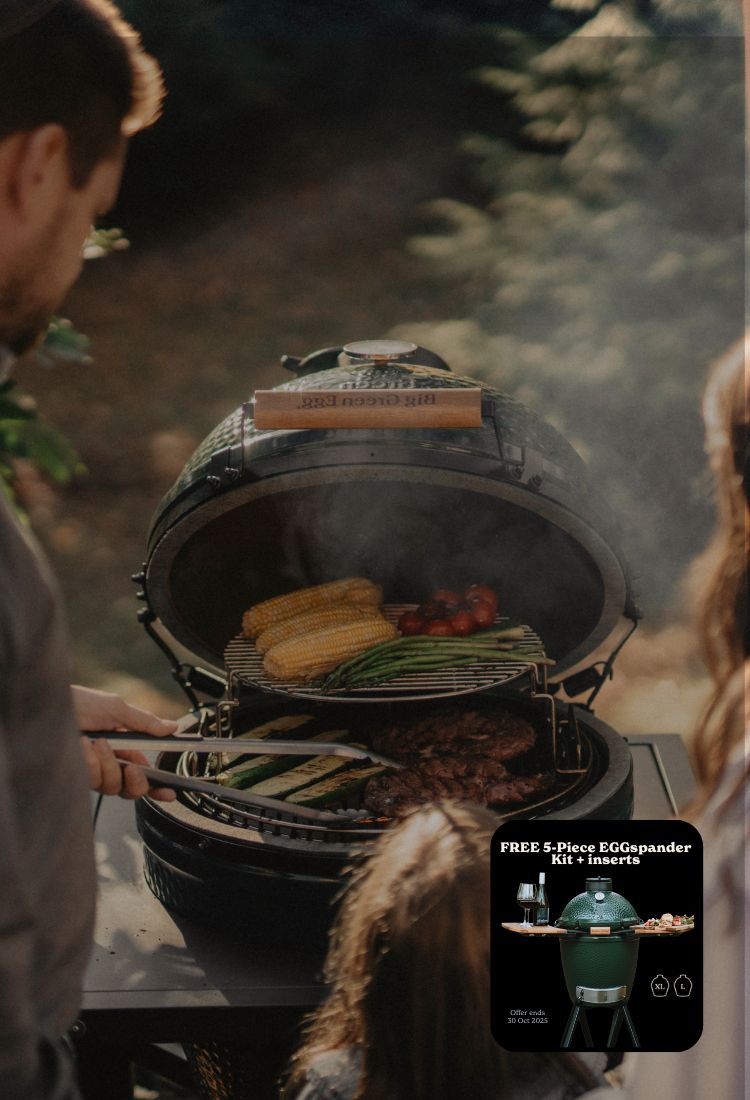 People grilling outdoors with a Big Green Egg grill, promotional text overlay.