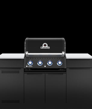 A black outdoor kitchen island set featuring a built-in gas grill with four blue-tinted control knobs, white countertops, and matching black side cabinets, shown against a solid black background.