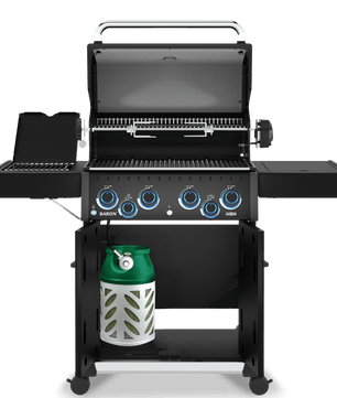 A black gas grill with four blue control knobs, shown open on a wheeled stand with a green and white propane tank underneath, photographed on a clean white background.