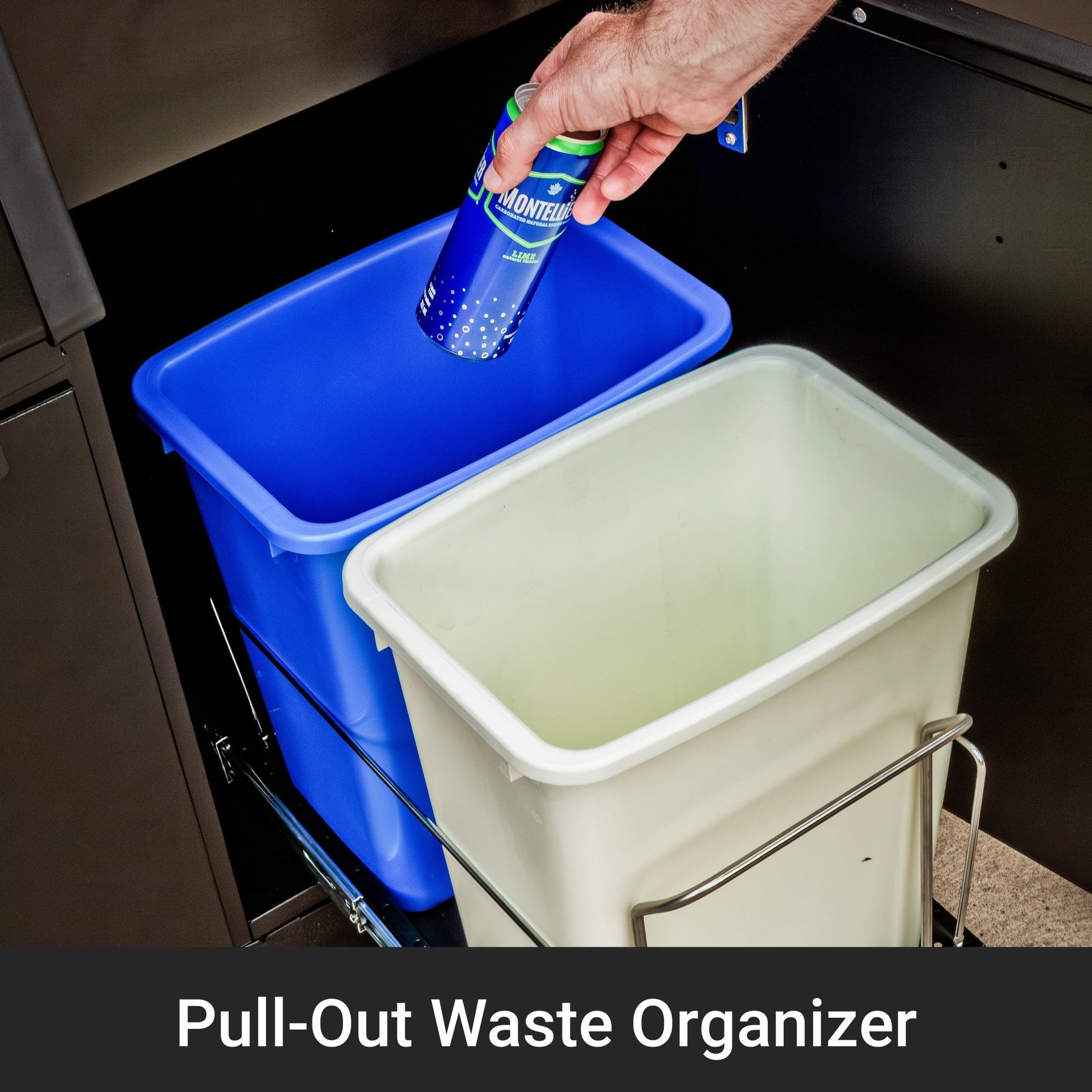 Person disposing of a bottle into a pull-out waste organizer with two bins.