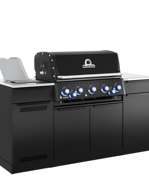 A black outdoor kitchen island set with a built-in gas grill, stainless steel countertops, and a side bar counter with an open laptop on top, shown on a plain white background.