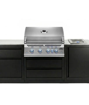 Stainless steel outdoor grill with black cabinets on a white background