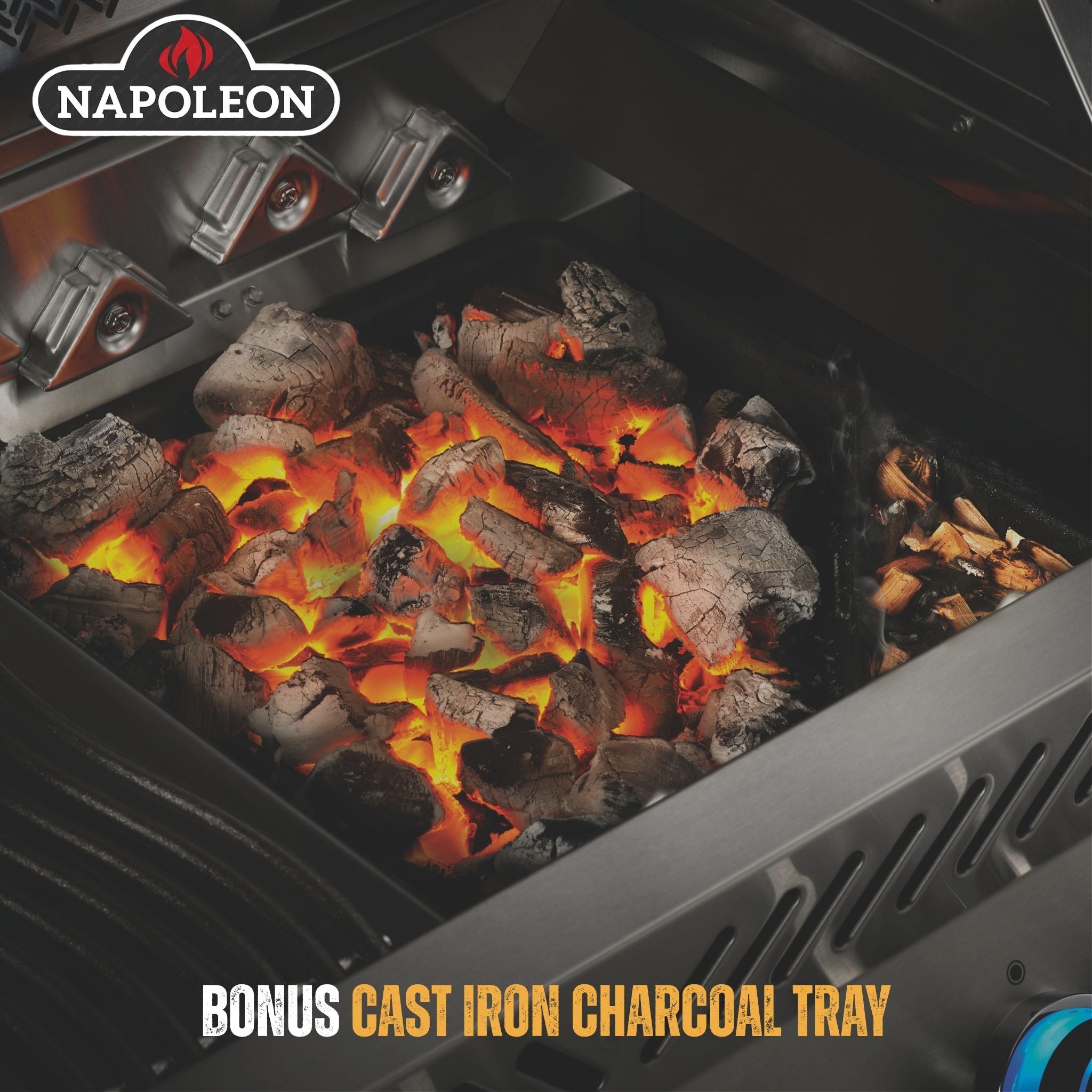 Napoleon grill with glowing charcoal and 'Bonus Cast Iron Charcoal Tray' text