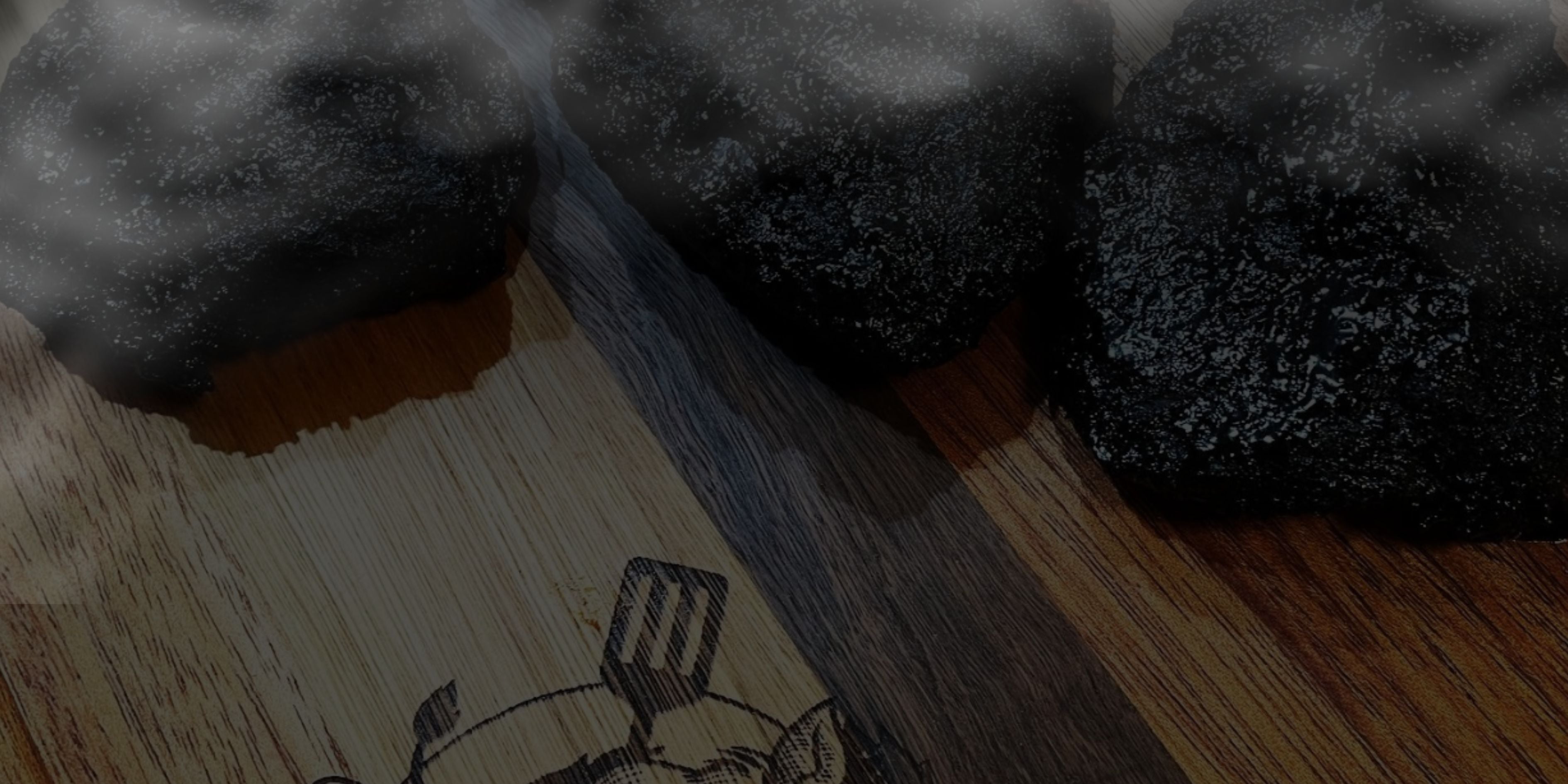 Close-up of a wooden surface with a small illustration and beef brisket