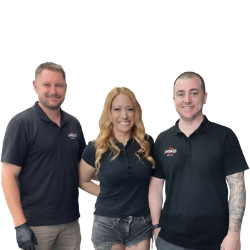 Three people wearing matching black polo shirts with a logo on a white background