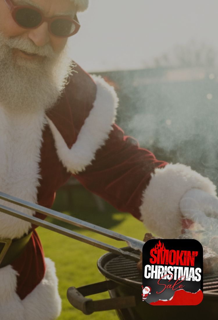 Person in Santa Claus outfit grilling with 'Smokin' Christmas' logo.