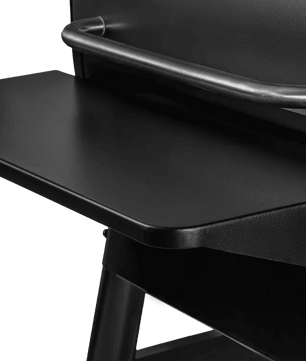 Close-up of a black chair with a tray on a white background