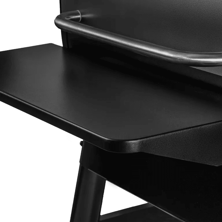 Close-up of a black chair with a tray on a white background