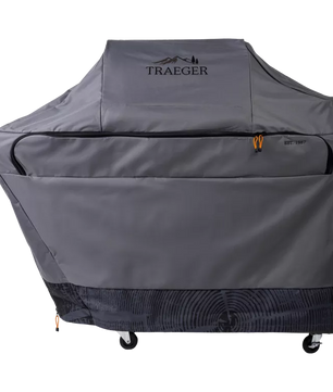 Gray grill cover with Traeger logo on a white background