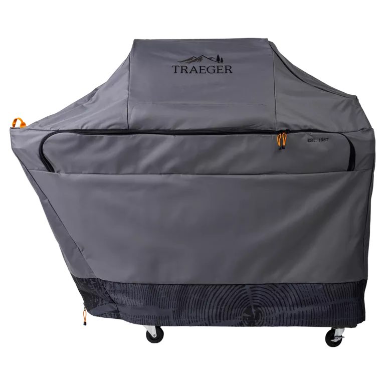 Gray grill cover with Traeger logo on a white background