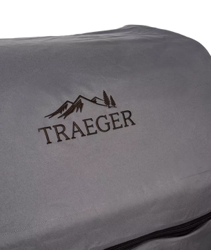 Gray Traeger grill cover with logo on a white background