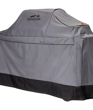 Gray grill cover with Traeger logo on a white background