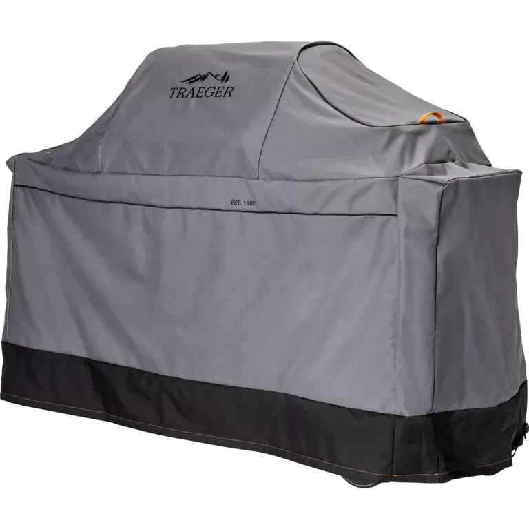 Gray grill cover with Traeger logo on a white background