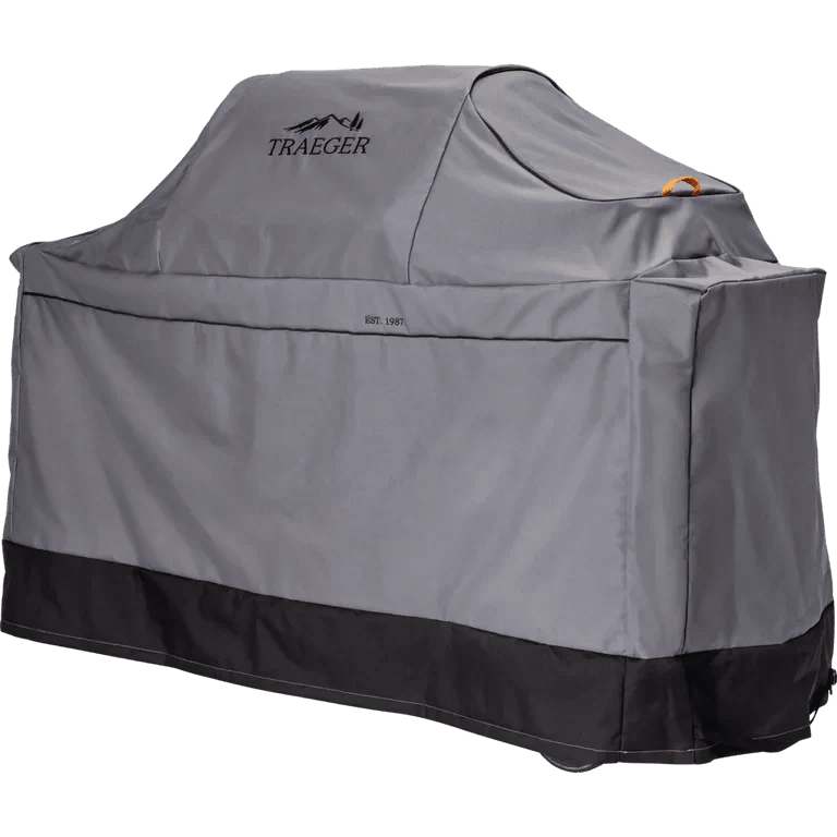 Gray grill cover with Traeger logo on a white background