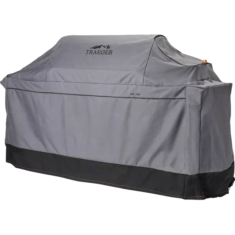 Gray grill cover with Traeger logo on a white background