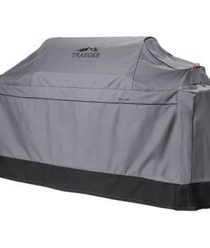 Gray grill cover with Traeger logo on a white background