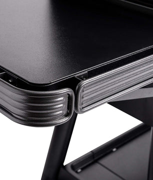 Close-up of a black metal desk corner with a white background