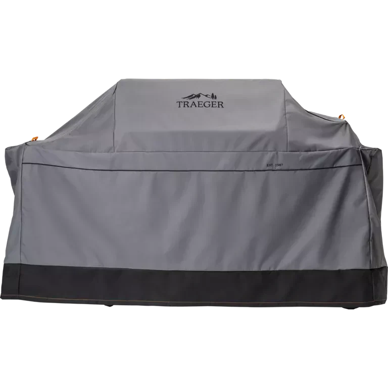 Gray grill cover with Traeger logo on a white background