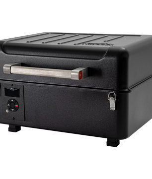 Black portable grill on a white background
