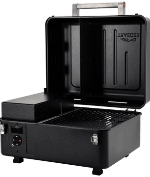 Black portable grill with open lid on a white background