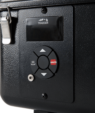 Control panel with Traeger logo on a black surface