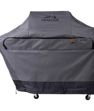 Gray grill cover with Traeger logo on a white background