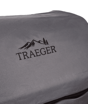 Gray Traeger grill cover with logo on a white background