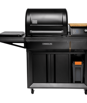 Black outdoor grill with wooden cutting board on a white background