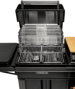Portable grill with multiple cooking surfaces on a white background